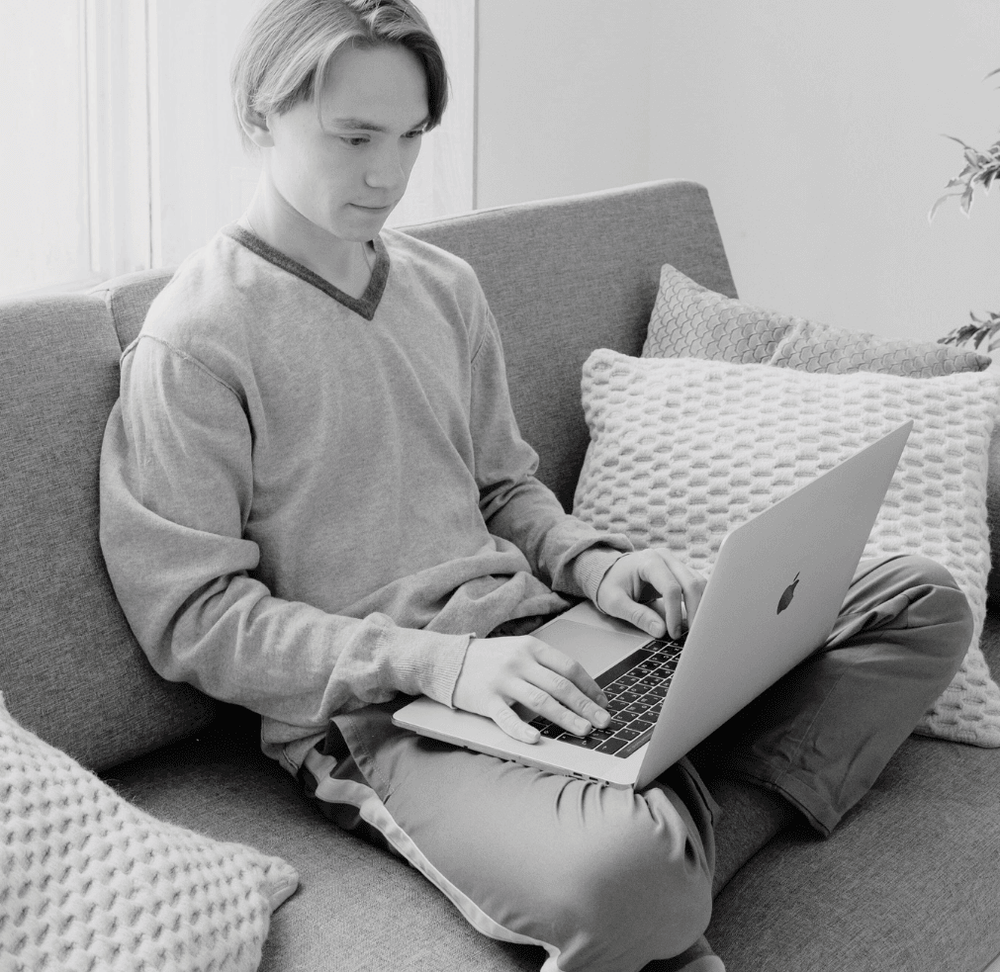 Without it: a laptop on the knees, on a sofa